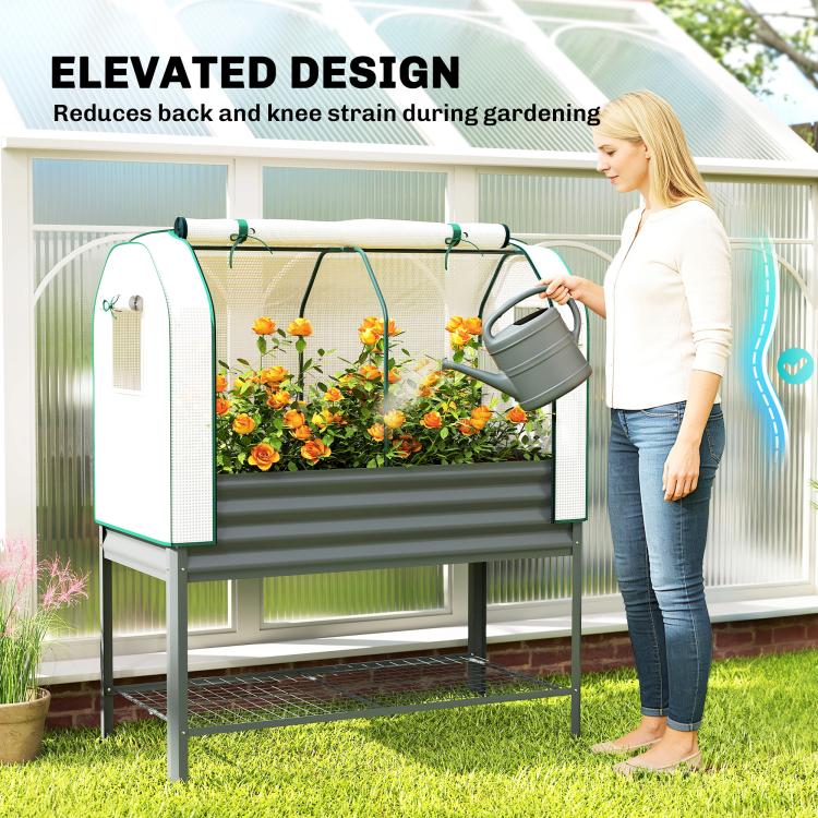 Elevated dark gray metal garden bed with greenhouse cover and clear mesh side doors
