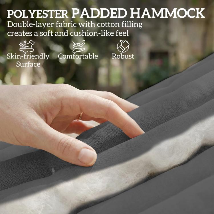 Gray padded hammock fabric with soft texture, close-up hand resting on surface