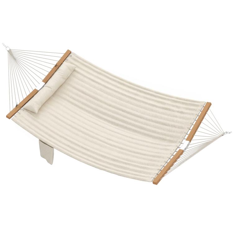 Cream hammock with attached pillow and pad, rope suspension and wooden end spreaders