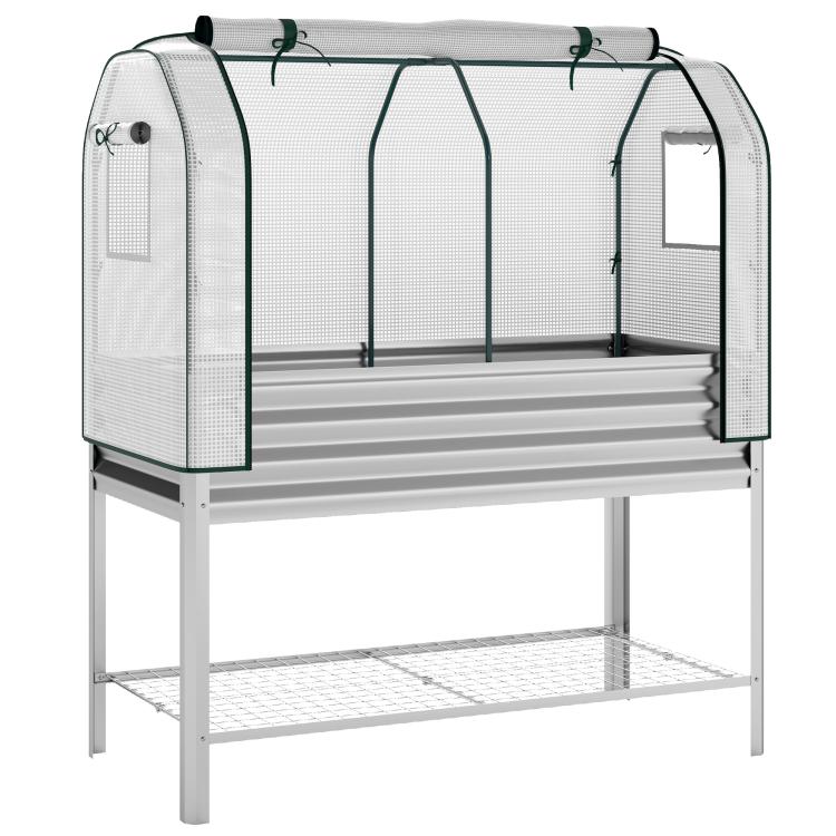 Raised garden bed with silver frame and clear greenhouse cover with green clips