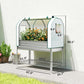 Silver raised garden bed with green greenhouse cover and lower shelf, side view