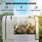 Raised garden bed with translucent white mesh greenhouse cover and two front doors
