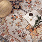 Boho medallion area rug with beige floral geometric pattern, tawny and navy, close-up