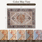Flat lay of boho medallion area rug, cream background with orange and blue motifs