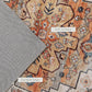 Close-up of rug surface texture and durable edge along boho floral geometric print