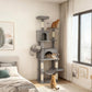 Dark gray cat tower beside a window with multiple platforms and two enclosed condos