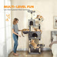 Dark gray cat tower with two hanging balls, condos, hammocks, and stacked perches