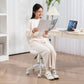Woman seated on white armless teddy fleece chair with heart-shaped back cutout