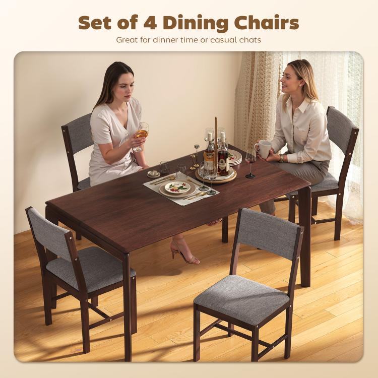 Set of 4 dining chairs with gray fabric seats and dark wood frames