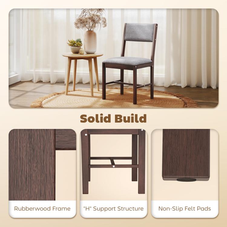 Gray upholstered dining chair with dark wood legs near a small side table