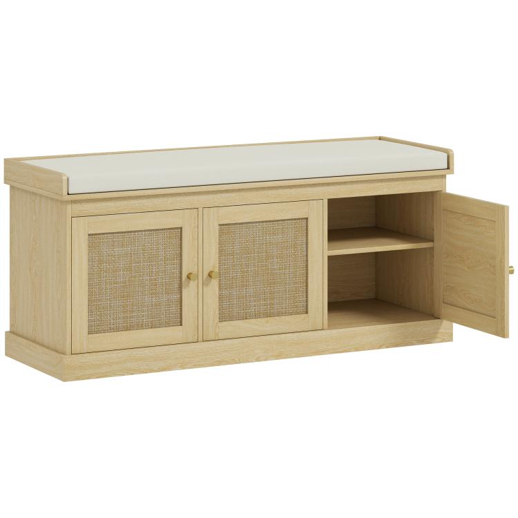 Shoe storage bench with cushioned top, woven rattan doors, open right shelves, oak tone