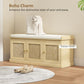 Light oak entryway shoe bench with woven rattan doors and cushioned seat, bag on top