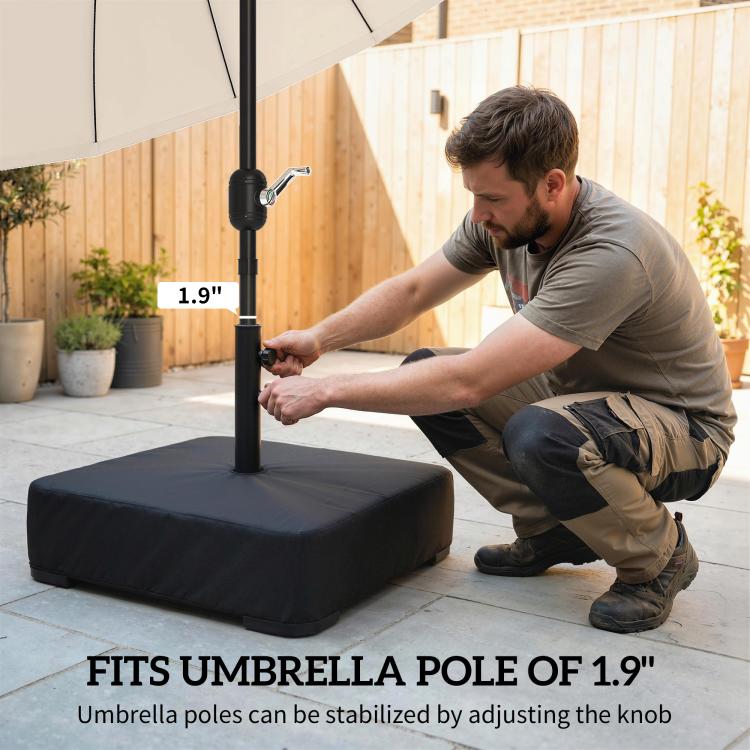 Black umbrella base with pole and adjustable knob, set up on patio