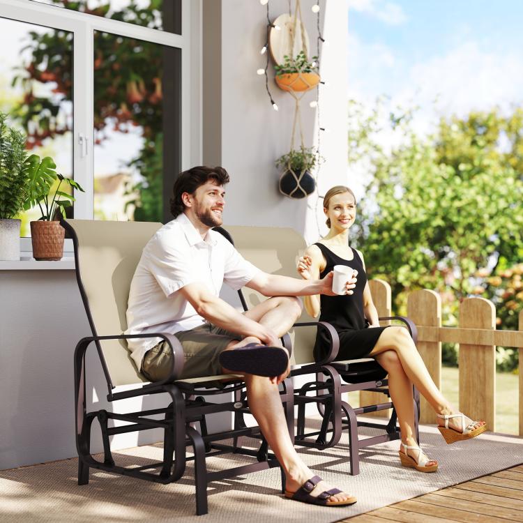 Two khaki mesh glider rocker chairs with dark frames, occupied on a patio