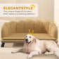 Beige pet sofa design graphic with rounded backrest and piped details