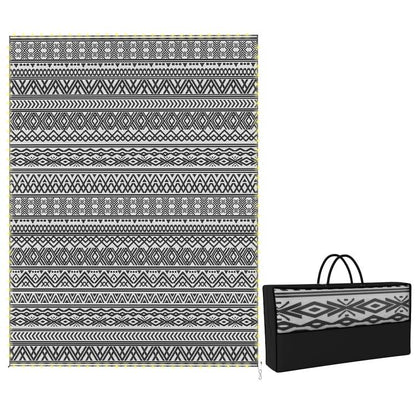 Outdoor rug carpet with black-and-white geometric pattern and matching carry bag