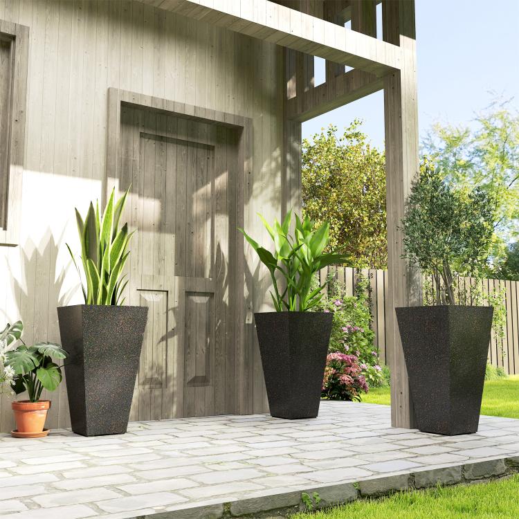 Stackable tall plant pots, dark speckled texture, set of 3 on a patio