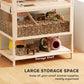 Wooden hamster cage with lower storage shelf and ramp leading to upper levels