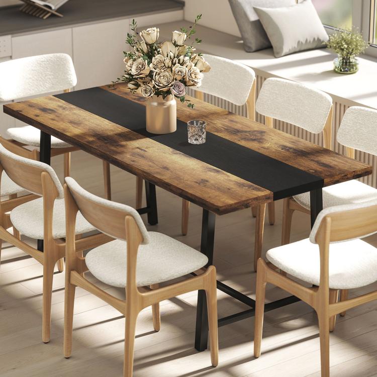 Brown industrial dining table with dark center stripe and steel legs, set for meals