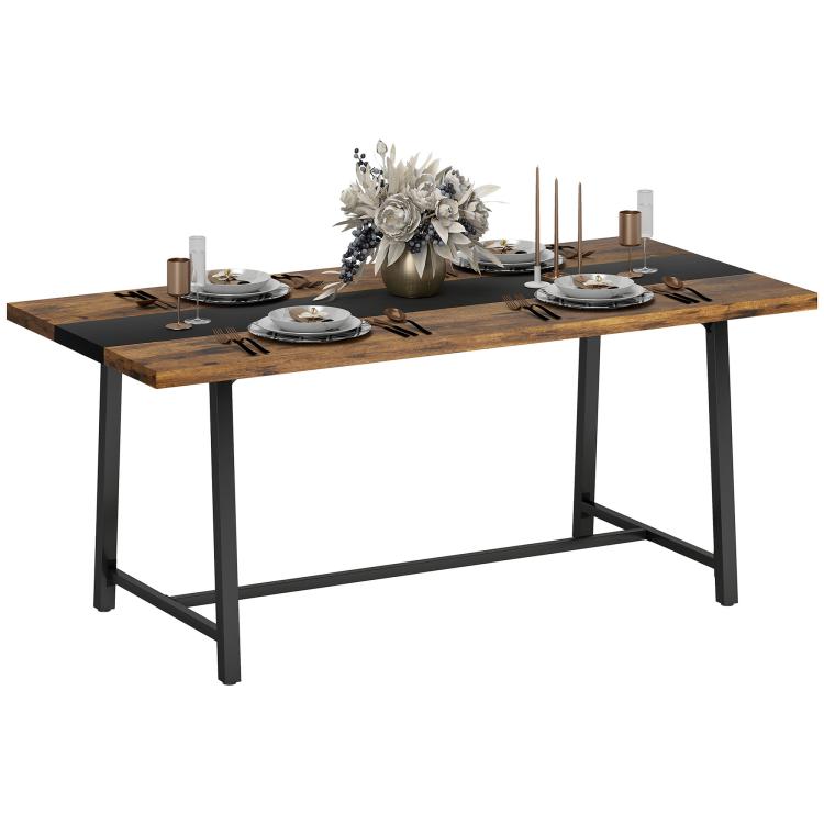 Brown dining table with dark stripe and four black steel legs, styled with place settings