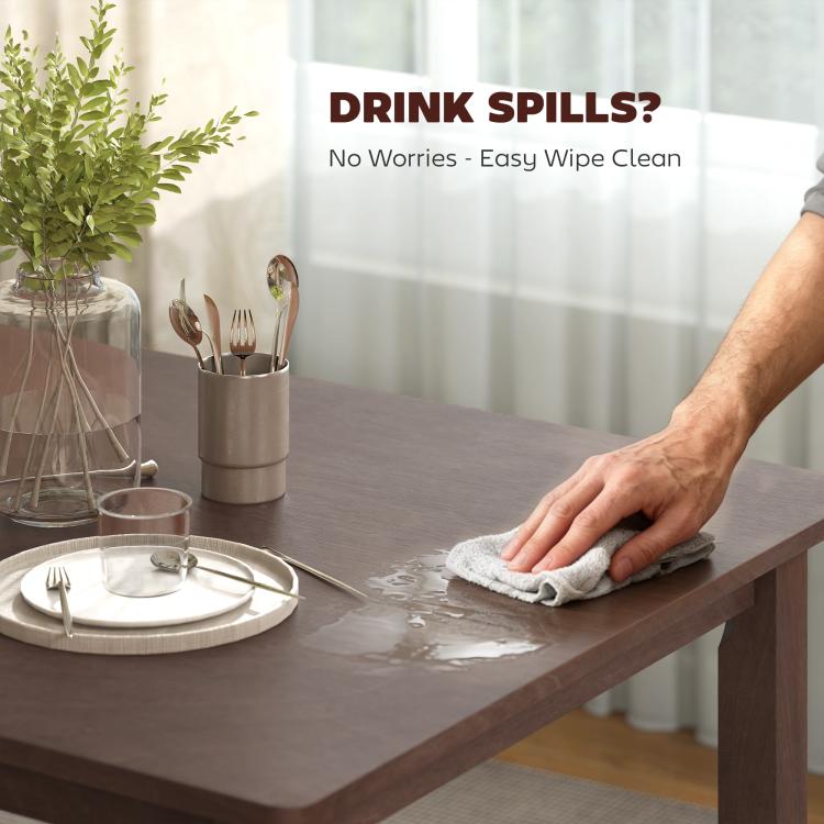 Dining table with dark wood surface, cloth wiping for easy clean