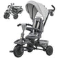 Gray kids tricycle with canopy, padded seat, and three-wheel frame