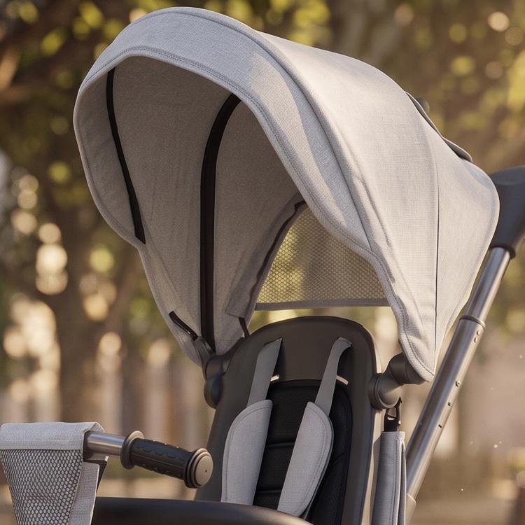 Gray kids tricycle stroller with removable canopy and padded reversible seat, side view