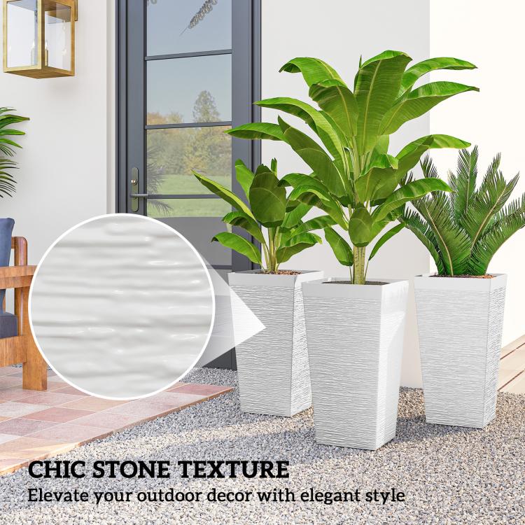 Set of three white stone-texture planters with assorted leafy plants