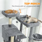 Top perch and side platforms on dark gray cat tree; two cats relaxing and lounging.