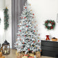 Decorated frosted artificial Christmas tree with red and gold ornaments and star topper