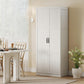 White tall pantry cabinet with paneled doors and black handles in a home setting