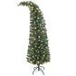 Slim green prelit Christmas tree with warm white lights and metal stand, angled top view