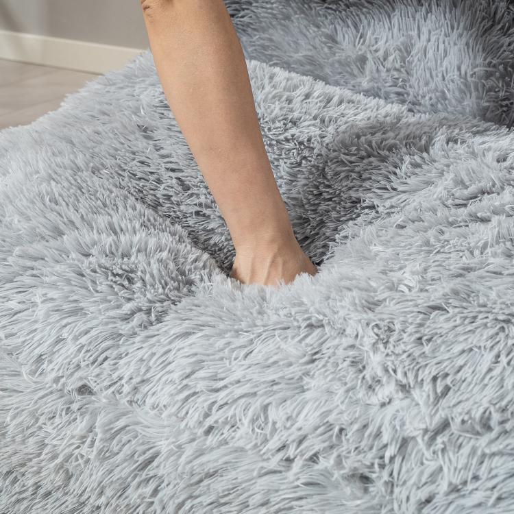 Light gray plush floor mattress pad with shag texture, close-up view