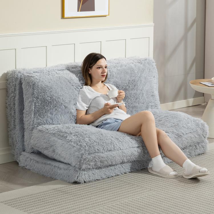 Light gray plush floor sofa bed with wide seat and upright backrest