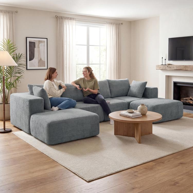 Dark gray U-shaped sectional sofa with chaise ottoman and back cushions