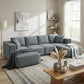 Dark gray modular sectional sofa with chaise lounge ottoman and multiple back cushions