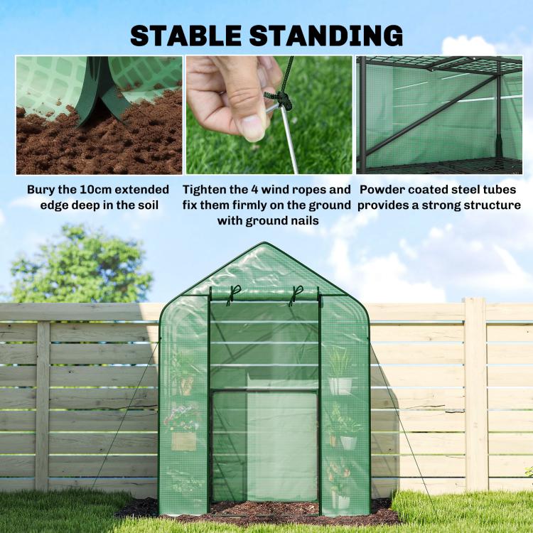Green portable greenhouse anchored with ground stakes and secured ropes