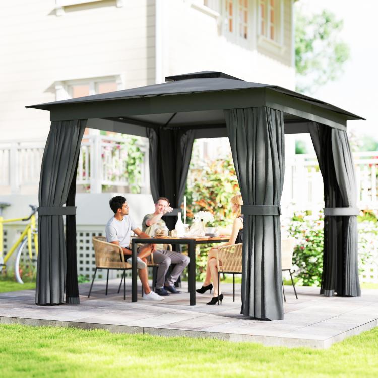 Dark gray patio gazebo with curtains framing a backyard dining area