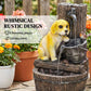 Yellow puppy and bird figures on a rustic three-tier resin fountain with water flow.