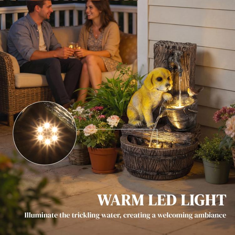 Dog fountain on patio with warm LED glow and cascading water between tiers.