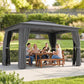 Outdoor patio gazebo with dark gray curtains and a dining table setup
