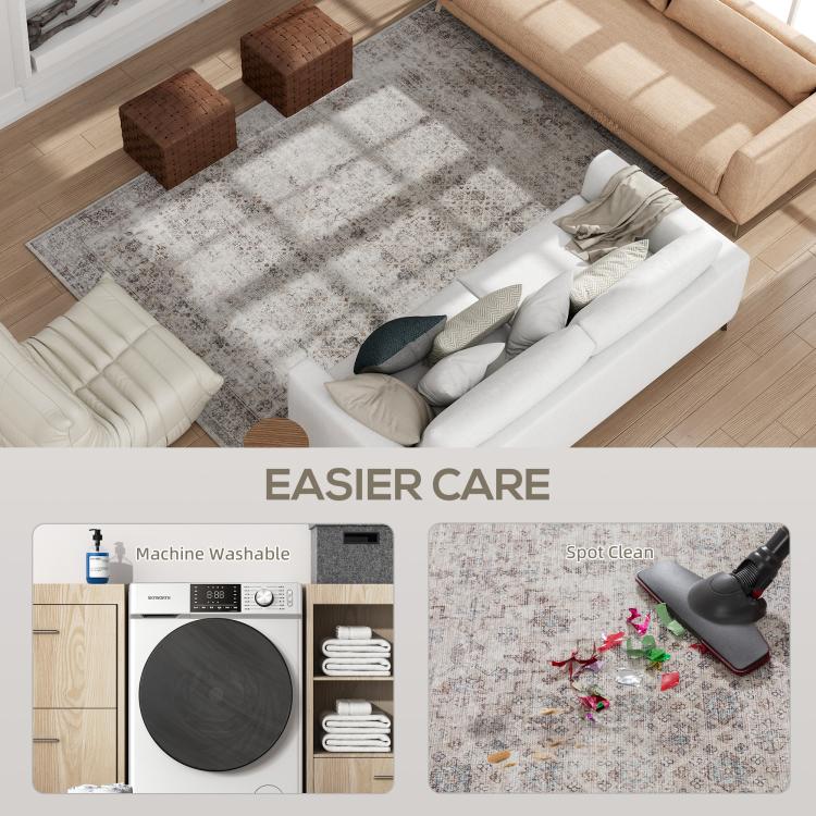 Distressed gray area rug centered in living room seating area