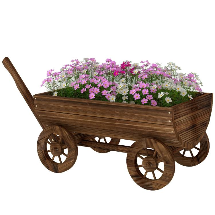 Wooden wagon planter box on four wheels with a long handle, filled with flowers