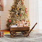 Wooden wagon planter box with four wheels and tall handle, open top