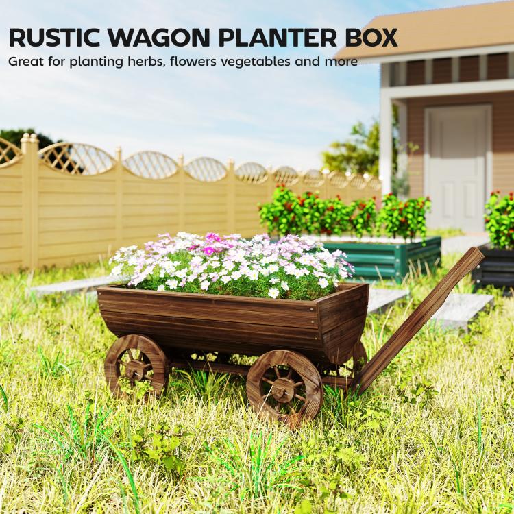 Rustic wooden wagon planter box with flowers on four wheels, long angled handle