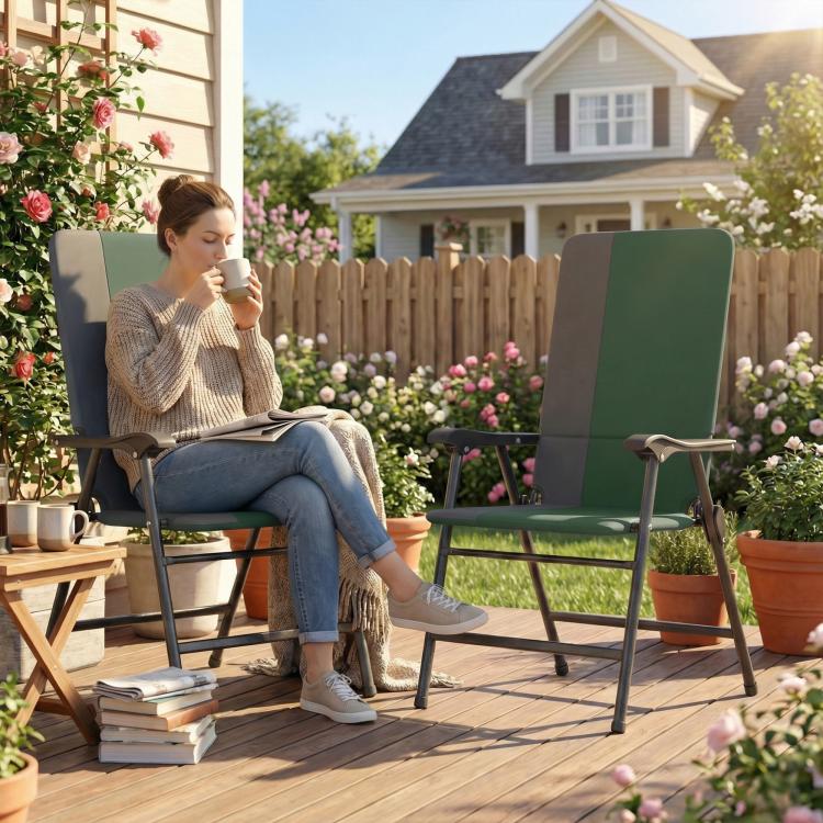 Dark green padded high-back folding patio chair with armrests on outdoor deck