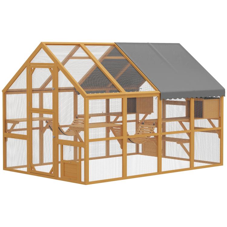 Wooden cat enclosure with gray waterproof cover, wire mesh panels, and multiple platforms