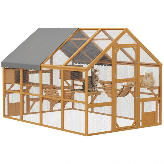 Large wooden outdoor cat enclosure with gray canopy, wire mesh walls, and side doors