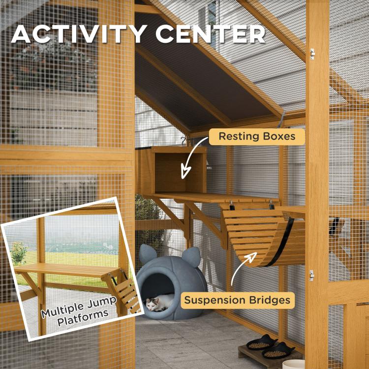 Wooden cat activity center with ramps, hanging bridges, and resting boxes inside mesh walls