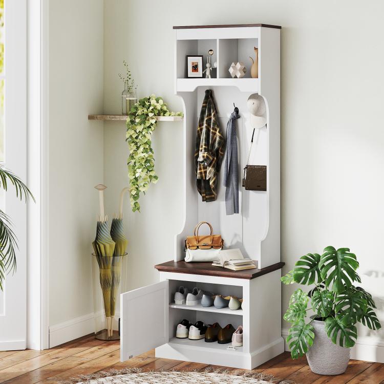White hall tree with coat hooks, open shoe shelves, and storage bench